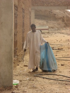 We watched this man with has hand rake and plastic bag working the streets near to the bar where we sat - picking up rubbish. Compliments to the town managers; it may be dusty and represent 'Sudan small town anywhere', but it was reasonably clean.